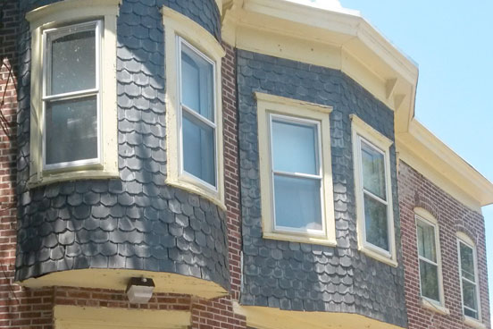 Windows and building exterior of a home on the East side.